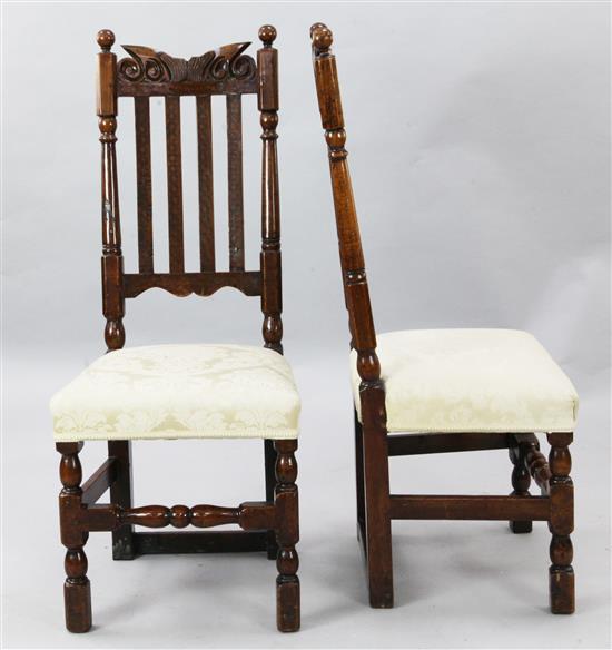 A pair of late 17th century fruitwood dining chairs, W.1ft 6in. H.3ft 7in.